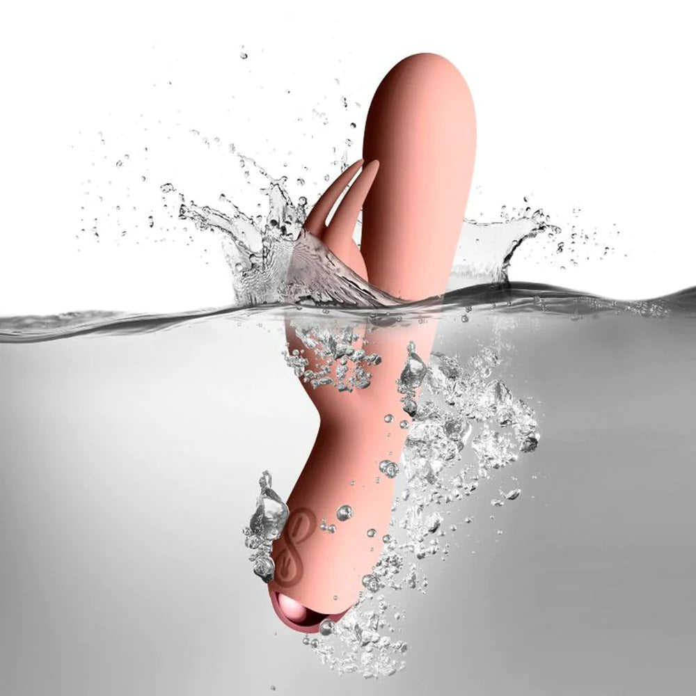 rocks off pink rabbit vibrator partially submerged in water with splash detail