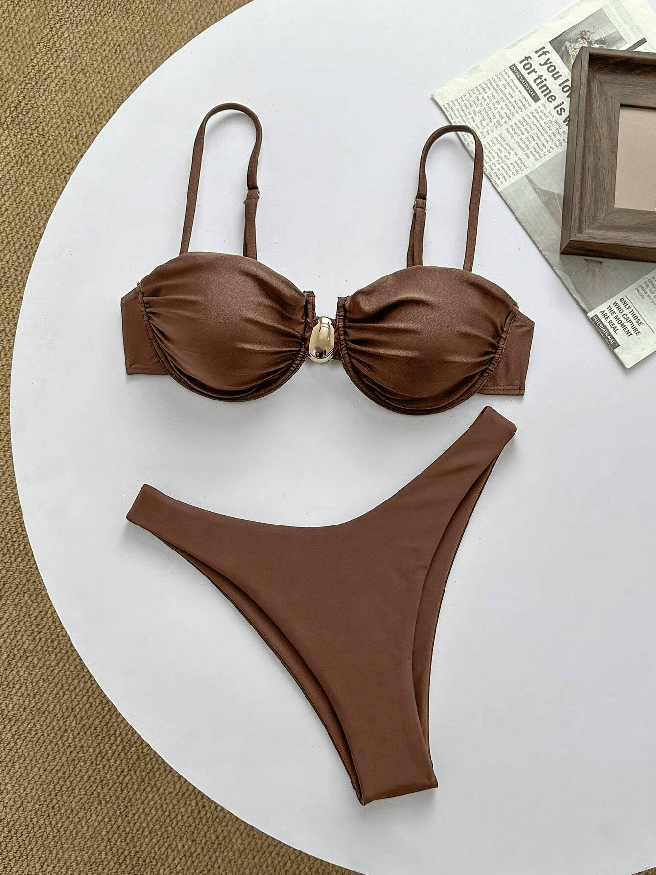 liberty brown bikini set laid flat with ruched cups, thin straps, gold centre clasp and high-leg bottoms