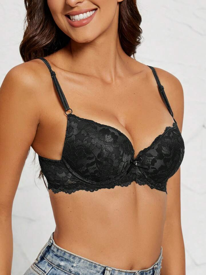 black sexy lace padded plunge bra on model with scalloped band and ring strap details
