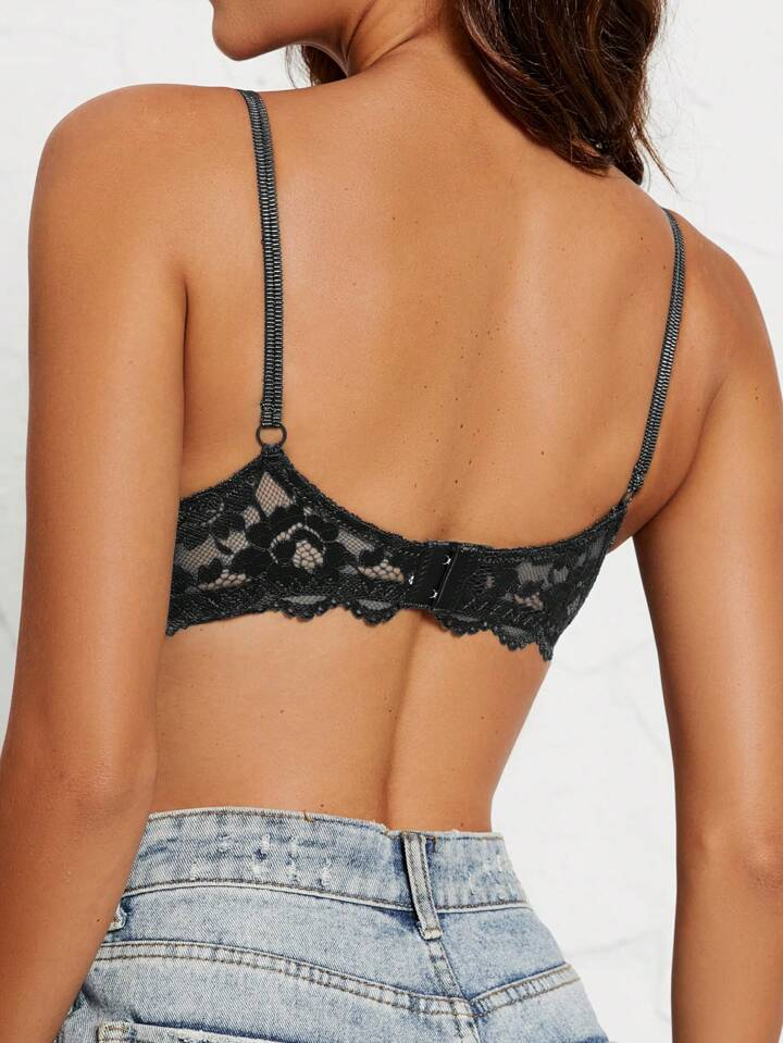 back view of the black sexy plunge bra with sheer floral lace band, adjustable straps and hook closure