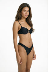 liberty black bikini on model with slim straps, ruched underwire top and high-leg bottoms